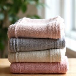 Soft, hand-knitted blankets neatly folded